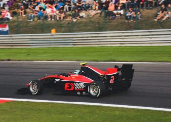 red and black go kart on track